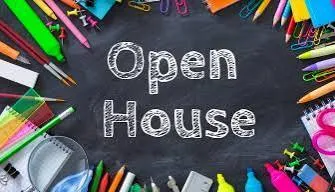 The words "Open House" written on a chalkboard with colored pencils surrounding them.